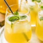 Green tea lemonade with mint and lemon in a glass